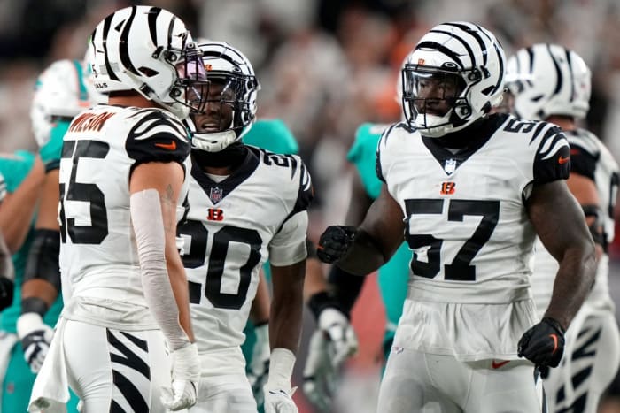 Sep 29, 2022; Cincinnati, Ohio, USA; Cincinnati Bengals linebacker Germaine Pratt (57) and cornerback Eli Apple (20) congratulate linebacker Logan Wilson (55) on a tackle for loss in the third quarter against the Miami Dolphins at Paycor Stadium in Cincinnati. The Cincinnati Bengals won, 27-15 to improve to 2-2 on the season. Mandatory Credit: Kareem Elgazzar-USA TODAY Sports